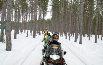 This is a picture of people snowmobiling at Beaver Creek Resort in Gaylord, MI